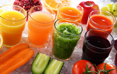 Glasses with fresh organic vegetable and fruit juices