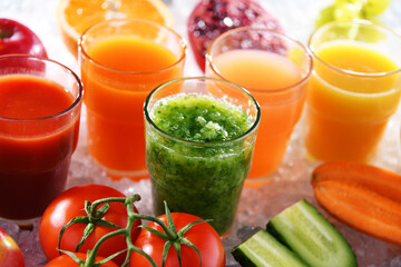 Glasses with fresh organic vegetable and fruit juices