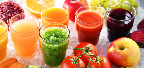 Glasses with fresh organic vegetable and fruit juices