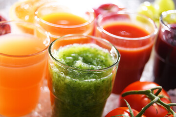 Glasses with fresh organic vegetable and fruit juices