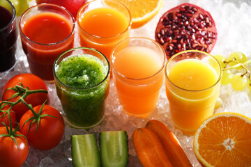 Glasses with fresh organic vegetable and fruit juices