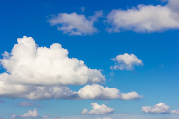 Naklejka na ściany i meble Blue sky background with clouds. Clouds on a clear day