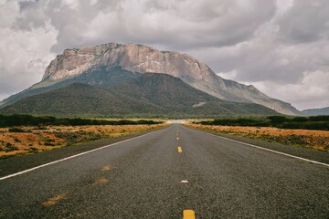 Scenic view of an empty higway against the background of Mount Ololokwe in Kenya