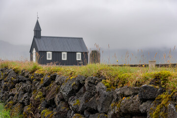 Stone wall in front of the Budakirkja church in Iceland