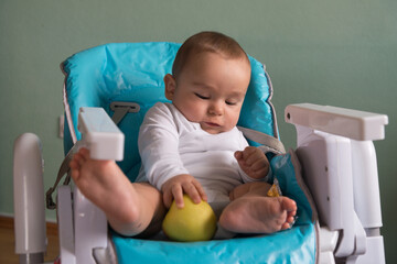 Baby playing with apple