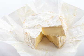 Camembert cheese on white background.