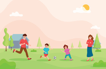 Father and children playing football together,mother standing beside,family hobby,relax time,