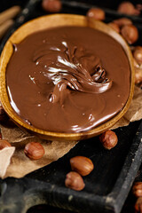 A plate of hazelnut butter on a cutting board.