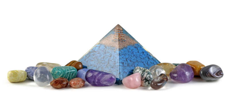 Copper spiral and clear quartz on top of blue chip stones inside Orgone pyramid surrounded by mixed tumbled healing stones transparent png file