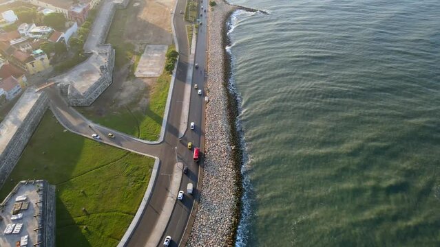 Aerial shot drone flying over baluarte santo domingo toward Bocagrande