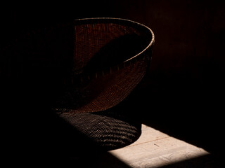 The shadow of the bamboo basket in the kitchen, light and shadow