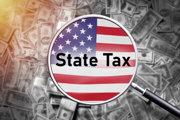 Fototapeta premium USA state tax. Magnifying glass over flag of America. Payments to USA federal budget. State tax logo and dollar bills. Concept of taxes on property or income. Mandatory federal payments. 3d rendering.