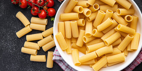 rigatoni raw pasta healthy meal food snack on the table copy space food background rustic top view