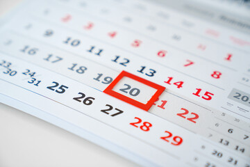 the red tab on the flip calendar page. 