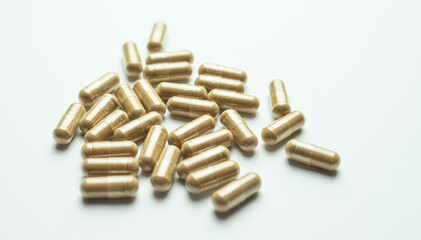 Ashwagandha capsules on a white background, tablets supporting immunity, supplementation of the body with essential ingredients