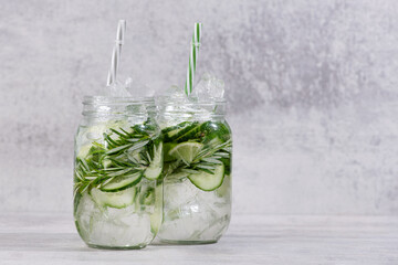 Fresh Sassi water with cucumber, lime and rosemary in jar