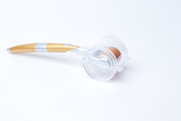 Derma roller isolated on a white background.with cover 