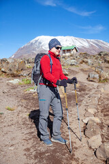 Male backpacker on the trek to Kilimanjaro mountain.