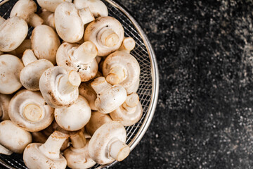 Fresh mushrooms in a colander. 