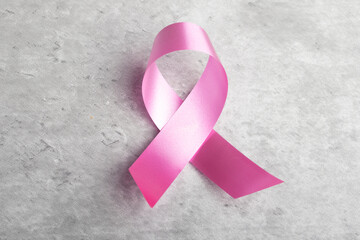 Pink ribbon on gray background.Symbol of breast cancer.