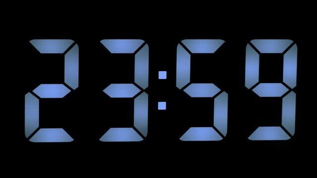 Blue digits on digital clock counts down the last seconds of the outgoing day or year, time 23-59, new year or new day concept