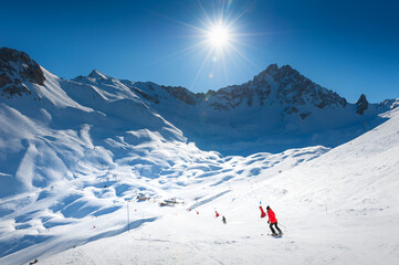 Ski resort in winter Alps mountains, France. View of ski slopes and ski lift. Meribel, France.