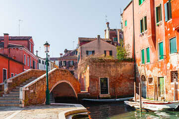 Old colorful architecture on the canal with bridge in Venice, Italy.