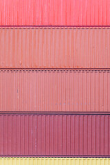 Stack of shipping containers with no numbers and without logos, import/export in harbor port, cargo freight shipping of container logistics industry, business commercial dock and transportation