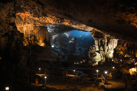 large foggy illuminated underground cave in limestone rock in vietnam