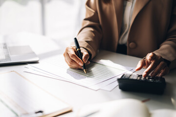 Young Happy Businesswoman Using Computer in Modern Office with Colleagues. Stylish Beautiful Manager Smiling, Working on Financial and Marketing Projects.