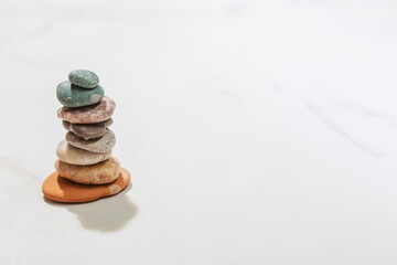 cairn  on white marble  background