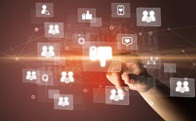 Hand pressing social media multimedia application screen with media icons on futuristic concept