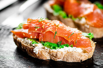 Sandwich with salmon and herbs. 