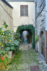 Fototapeta na wymiar A narrow street in the historic center of Patrica, an old village in Lazio in the province of Frosinone, Italy.
