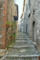 Fototapeta na wymiar A narrow street in the historic center of Patrica, an old village in Lazio in the province of Frosinone, Italy.