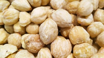 Pile of candlenut also known as kemiri, one of herbs that usually used for asian food as seasoning