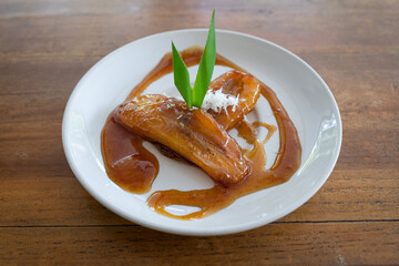 Side view of Balinese Kolak Pisang (plantain or banana in coconut milk and sugar syrup)