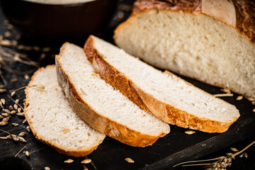 Sliced wheat bread on a cutting board. 