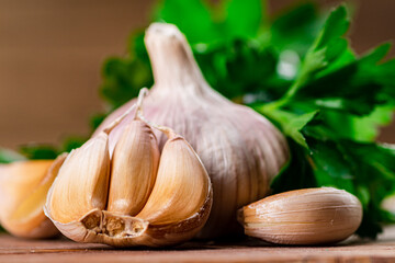 Cloves of fresh garlic with parsley. 