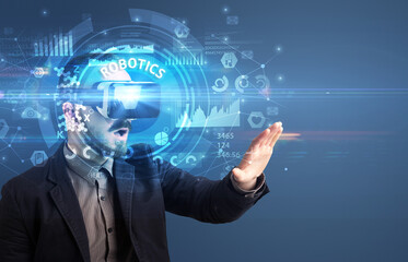 Businessman looking through VR glasses