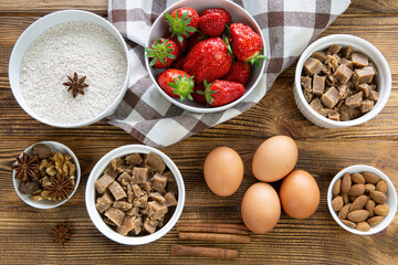 Tasty summer crumble pie preparation, top view. Pastry ingredients on rustic wooden background. 