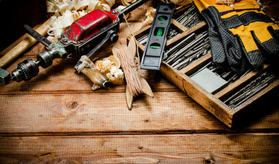 Various working tools on wood on the table. 