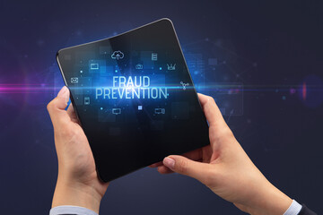 Businessman holding a foldable smartphone, security concept