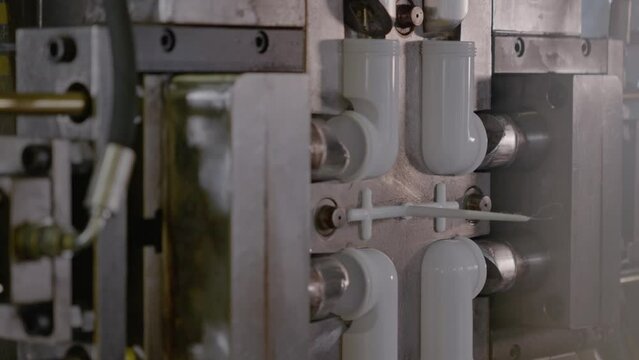 Injection molding machine for plastic products during operation. Technology for the production of plastic products from polypropylene.