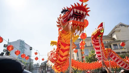  Dragon and lion dance show in chinese new year festival (Tet festival ), lion Dance - dragon and lion dance street performances in Vietnam. Selective focus. © CravenA