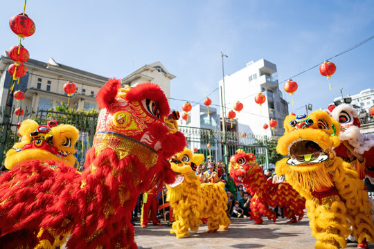 Dragon and lion dance show in chinese new year festival (Tet festival ), lion Dance - dragon and lion dance street performances in Vietnam. Selective focus.
