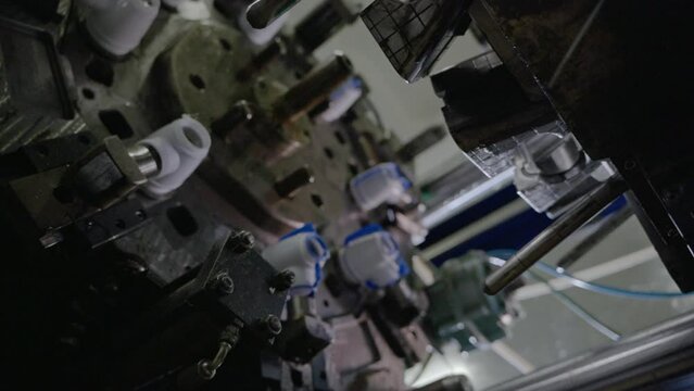 Injection molding machine for plastic products during operation. Technology for the production of plastic products from polypropylene.
