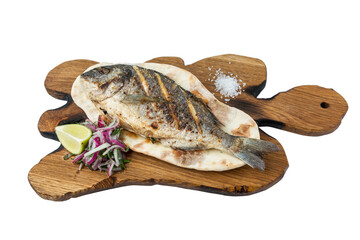 Fried dorado fish served on a wooden board with tortilla, onion, lemon and salt. Appetizing mediterranean dish. Close-up. Isolated on white background.