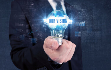 Businessman holding a light bulb, business concept