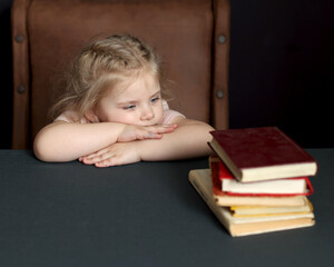 While preparing for school, the child studies at home. Distance learning, homework